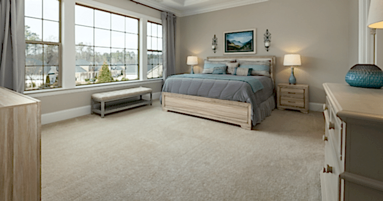 bedroom with a perfect executed carpet cleaning service